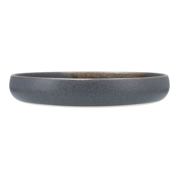 A close up of a Cloud Terre by Fortessa Iceland volcanic gray stoneware plate with a raised rim.
