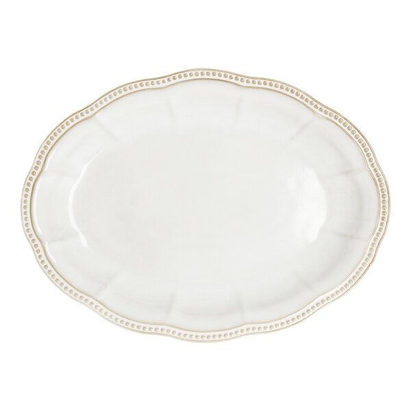 A white oval stoneware platter with an embossed pearl edge.