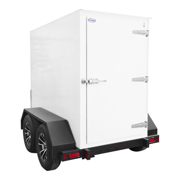 A white box on a white trailer with wheels.