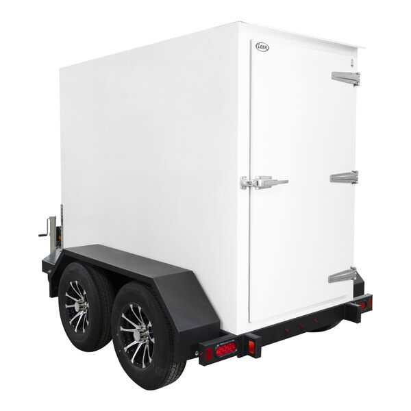 A white box on a white trailer with wheels.