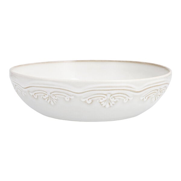 A white Mannette Floral stoneware bowl with an embossed floral design.