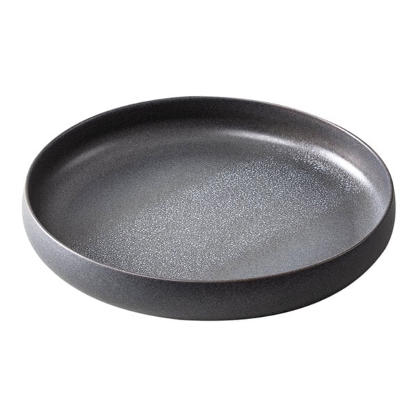 A Cloud Terre by Fortessa stoneware plate with a raised rim and speckled design in volcanic gray.