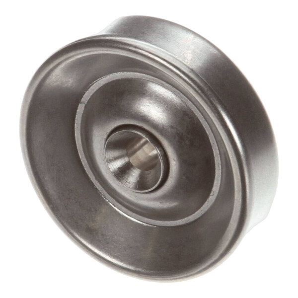 A stainless steel Montague skate wheel with a hole in the center.