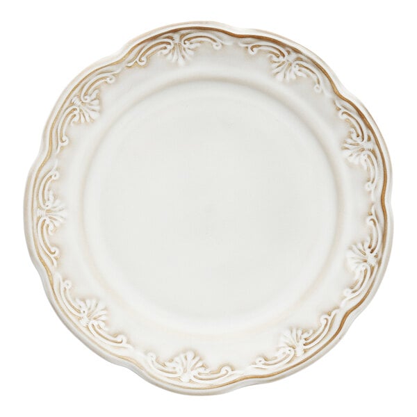 A white Mannette Floral stoneware salad plate with an embossed floral edge.