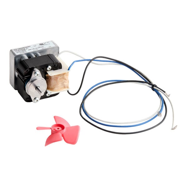 A small electric motor with attached wires and a separate red plastic fan blade.