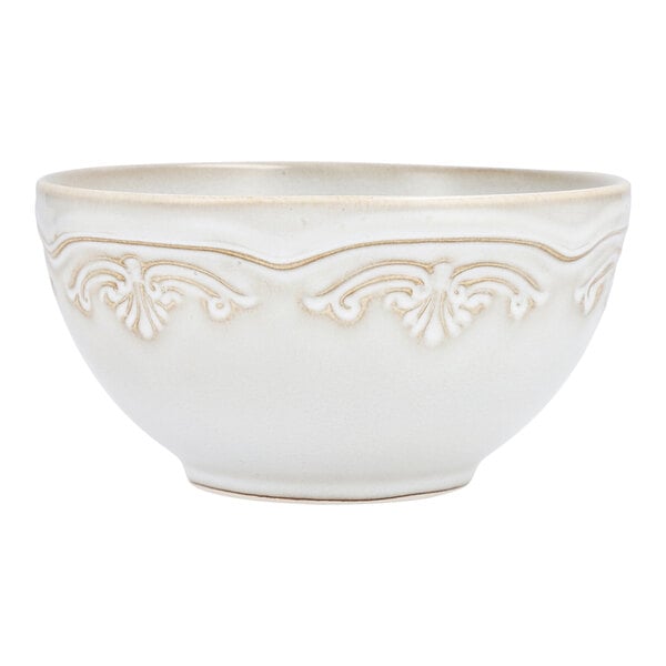 A white Mannette stoneware cereal bowl with an embossed floral design.