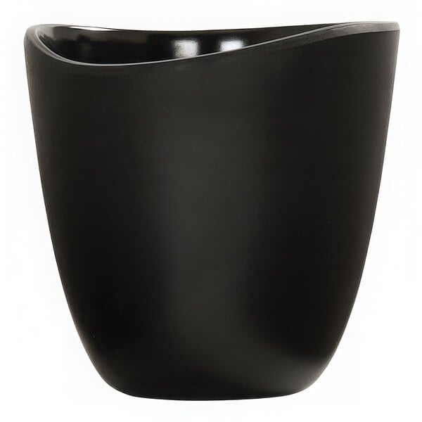 A black round melamine dressing crock with a slightly curved rim.