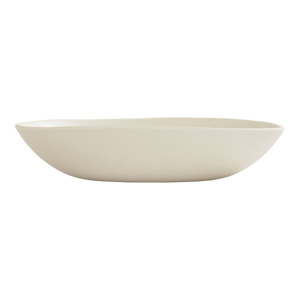 A large ivory melamine pasta bowl with a smooth, slightly irregular shape.