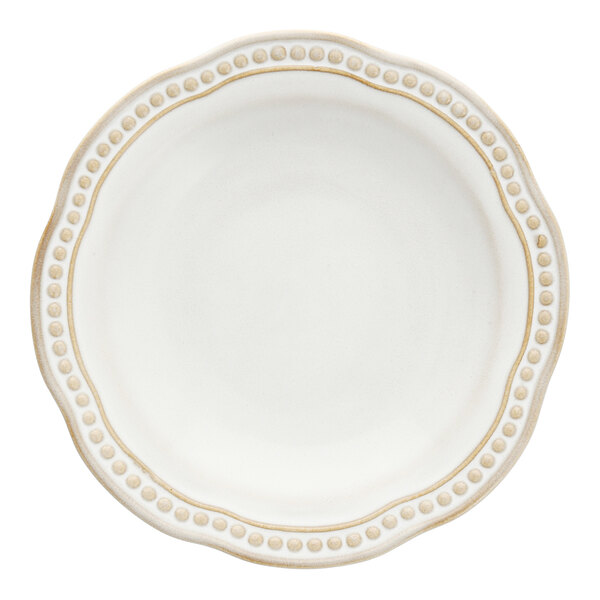 A close up of a Mannette Perls white stoneware bread and butter plate with an embossed pearl edge.