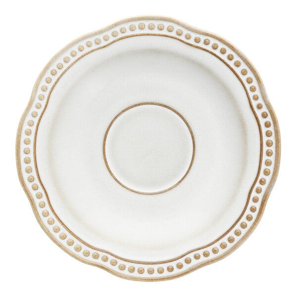 A white round saucer with a scalloped and embossed pearl edge.