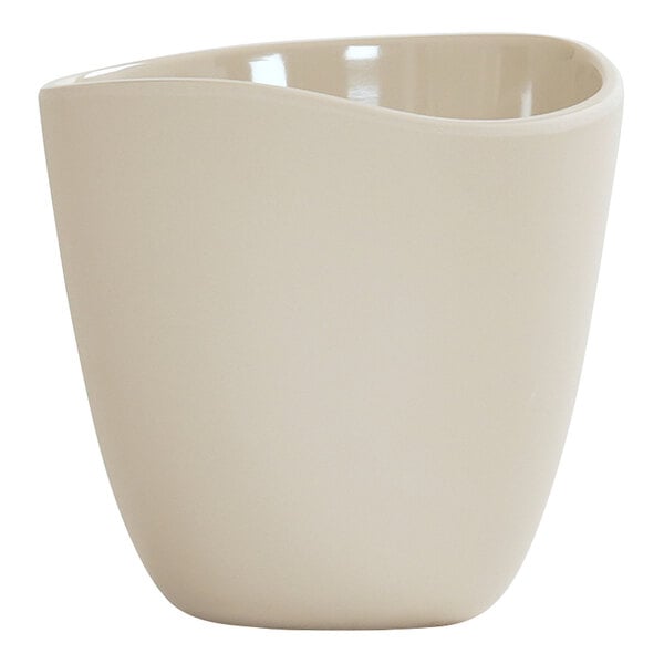 A round ivory melamine dressing crock with a smooth finish.