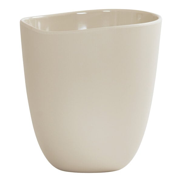 A large ivory round melamine dressing crock.