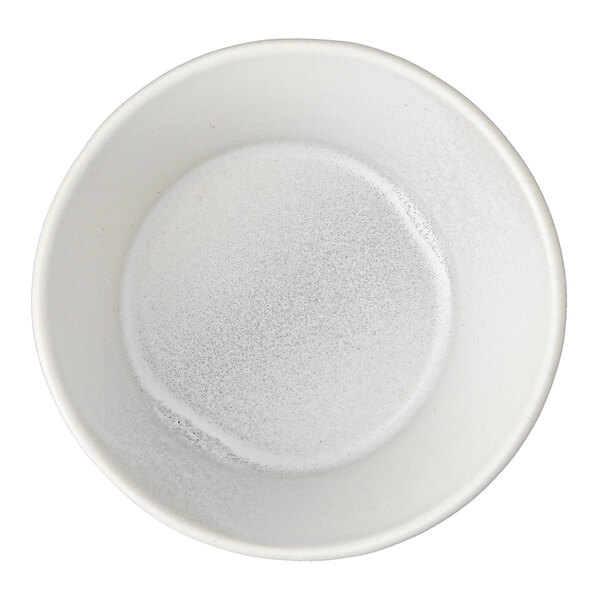 A white Cloud Terre by Fortessa stoneware bowl with soup in it.