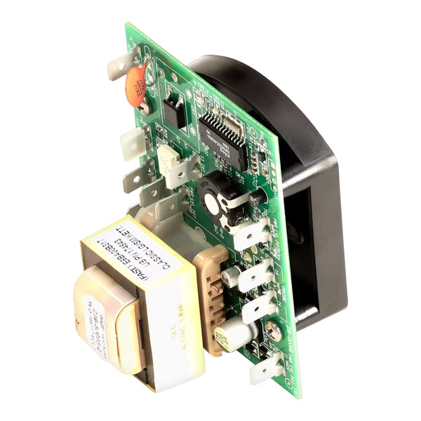 A close-up of a Groen control circuit board with white and yellow electrical devices.