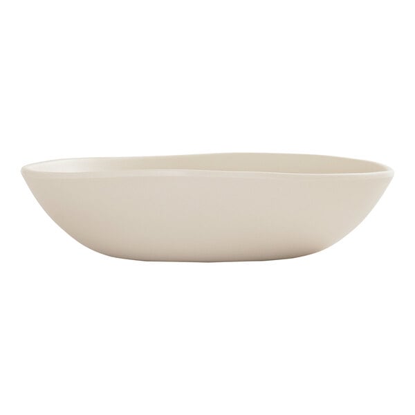 A beige melamine pasta bowl with a slightly irregular, coupe shape.