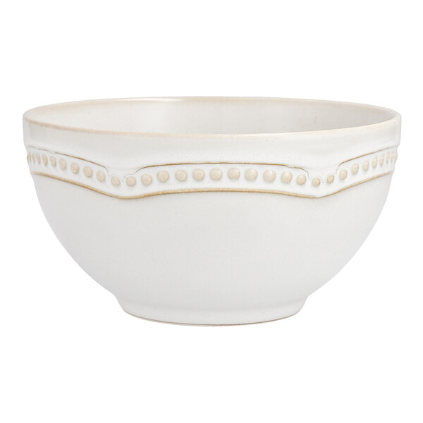 A white Mannette Perls stoneware bowl with an embossed pearl edge.