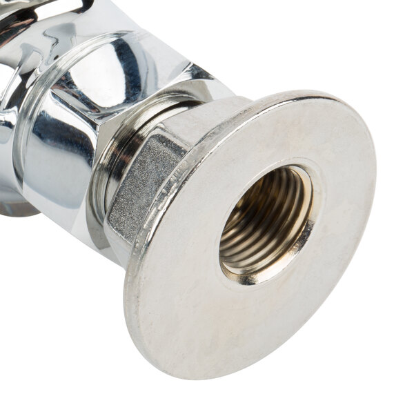 A chrome plated metal wall mount pipe fitting with a nut.