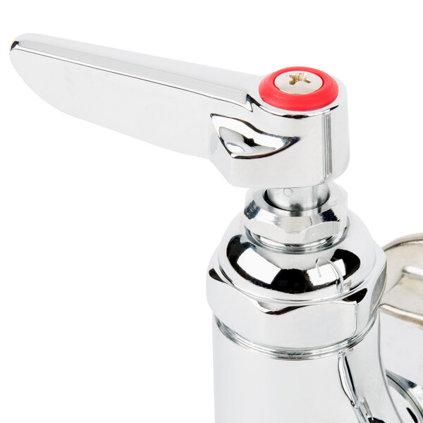 A chrome T&S wall mount faucet with red knobs.