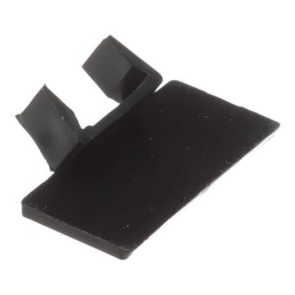 A black plastic Wilbur Curtis flavor clip with a hole in it.