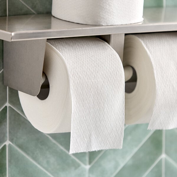 A Scott ComfortPlus mega toilet tissue roll on a shelf.