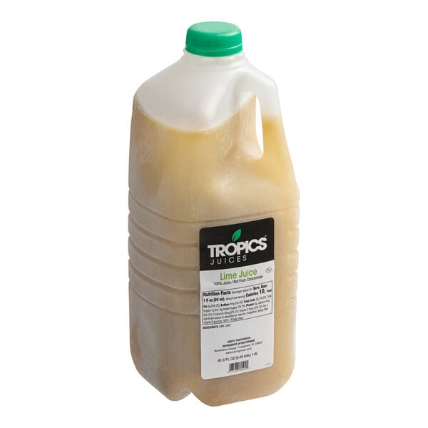 A Tropics Lime Juice jug with a green and yellow label.