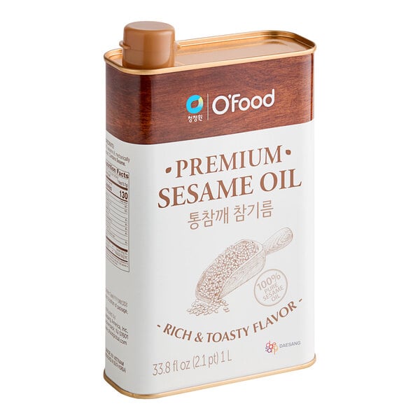 A white and brown container of O'Food Premium Toasted Sesame Oil with a label.
