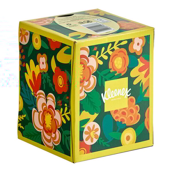 A Kleenex box with a floral design.