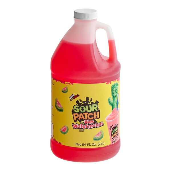 A red jug of SOUR PATCH KIDS Watermelon Slushy Concentrate with a yellow label.