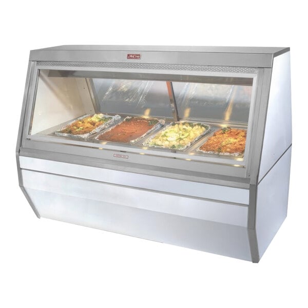 A Howard McCray 6-well hot food display case with food on trays.