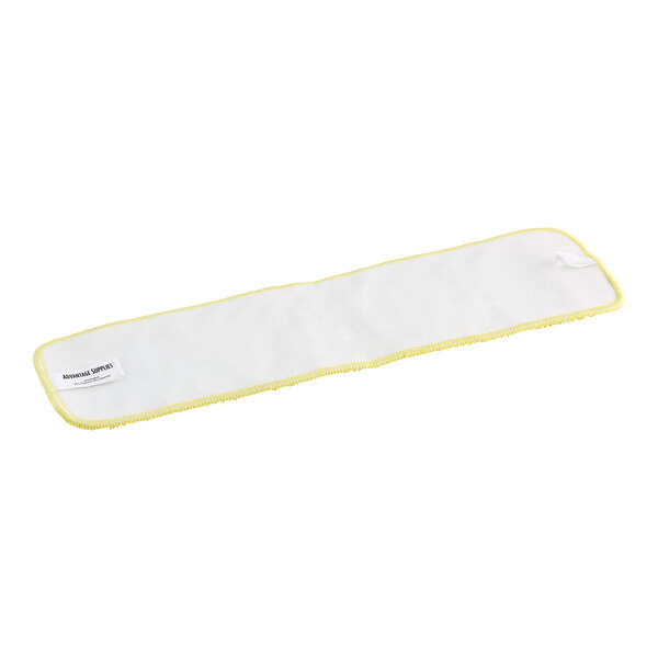 A white cloth pad with yellow trim on it.
