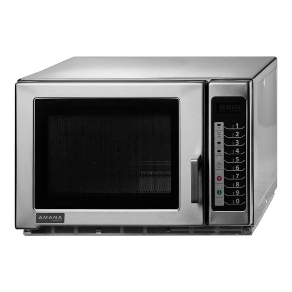 A silver Amana commercial microwave with a black door.