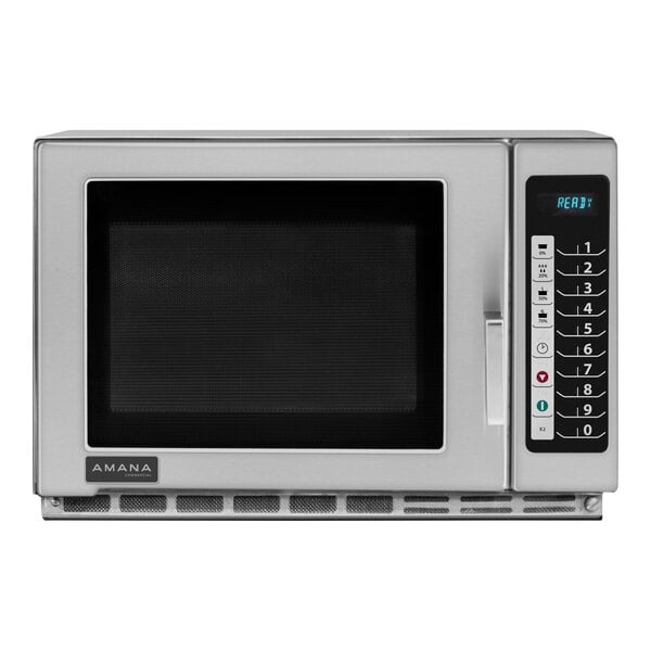 A stainless steel Amana commercial microwave with a black screen.