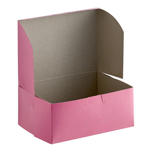 A pink Baker's Lane cake box with the lid open.