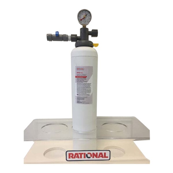 A white Rational water filter cartridge system on a counter.
