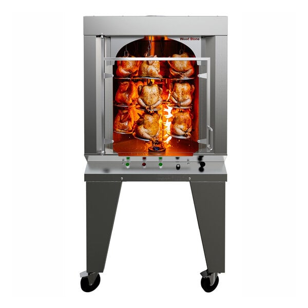 A Wood Stone vertical rotisserie oven with a chicken cooking inside.