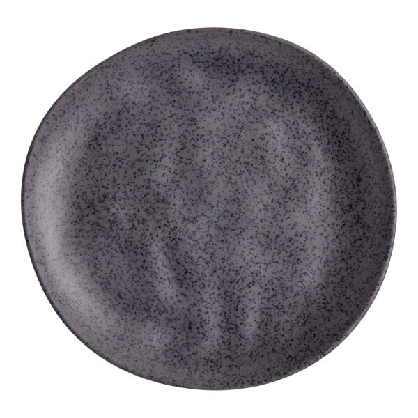 A dark gray round melamine plate with a speckled pattern.