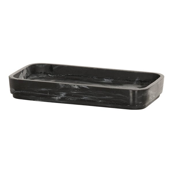 A black rectangular spoon rest with a swirl design.