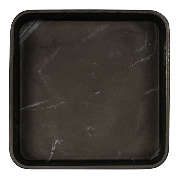 A black square bowl with a marbled surface.