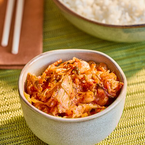 A bowl of spicy kimchi, a traditional Korean fermented vegetable dish.