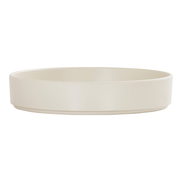 A round ivory melamine plate with a raised rim.