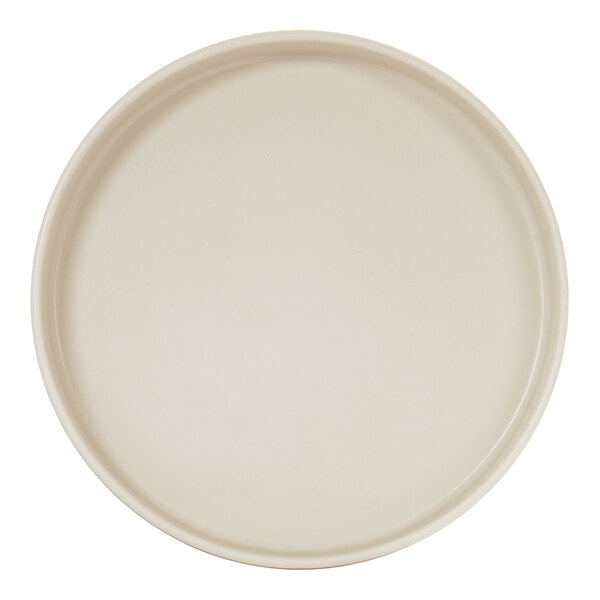 A round ivory melamine plate with a raised rim.