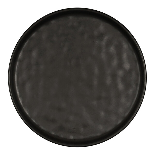 A close up of a Cal-Mil matte black round melamine plate with a wavy texture.