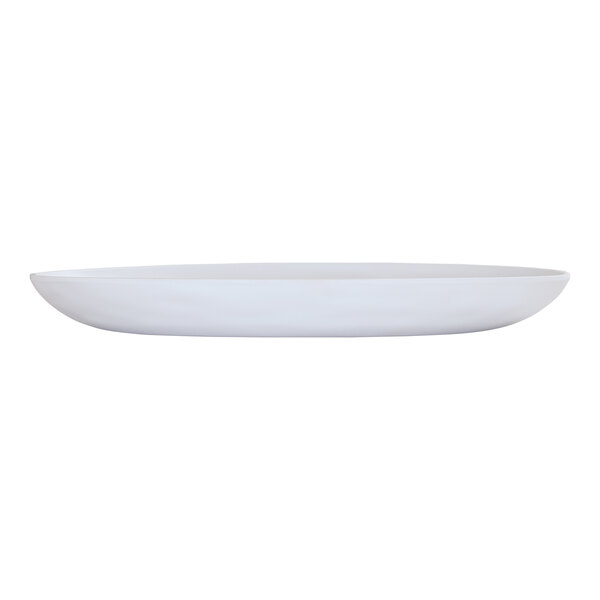 A matte white oval melamine platter on a white surface.