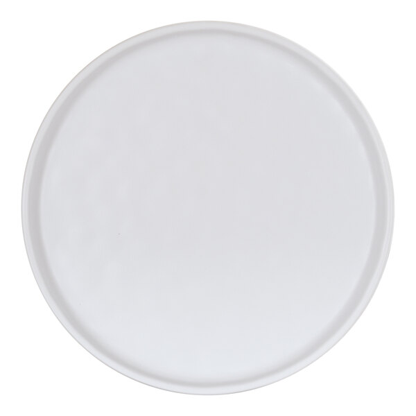 A Cal-Mil Carmel round melamine plate with a round rim on a white background.