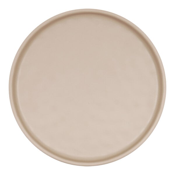 A Cal-Mil Carmel round melamine plate with a matte taupe rim.