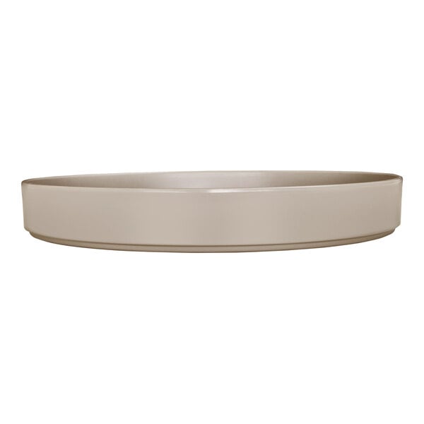 A taupe-colored, round melamine plate with a raised rim.