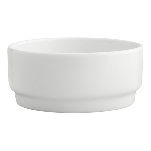 An Arcoroc white porcelain bowl with a white background.