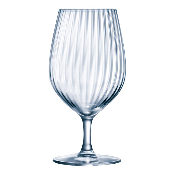 A close-up of an Arcoroc Serena clear wine glass with a curved design.