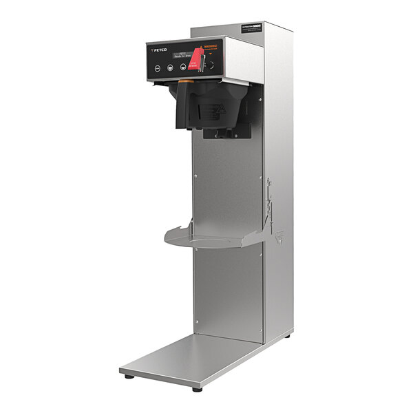 A Fetco MBS-1221 commercial coffee machine with a plastic brew basket on top.