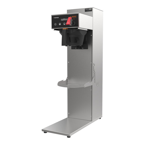 A Fetco commercial automatic coffee machine with a metal brew basket.